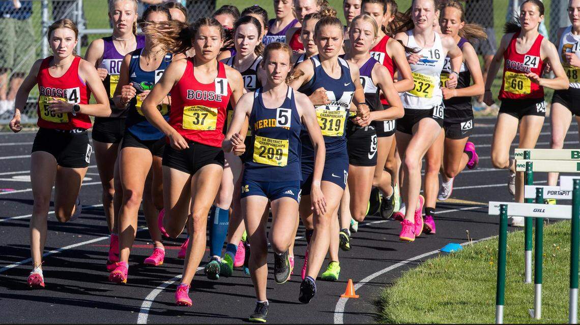 Girls run the 1,600 meters at the 5A District Three track meet held at Kuna High School last May. Allie Bruce of Boise (37) won the race.