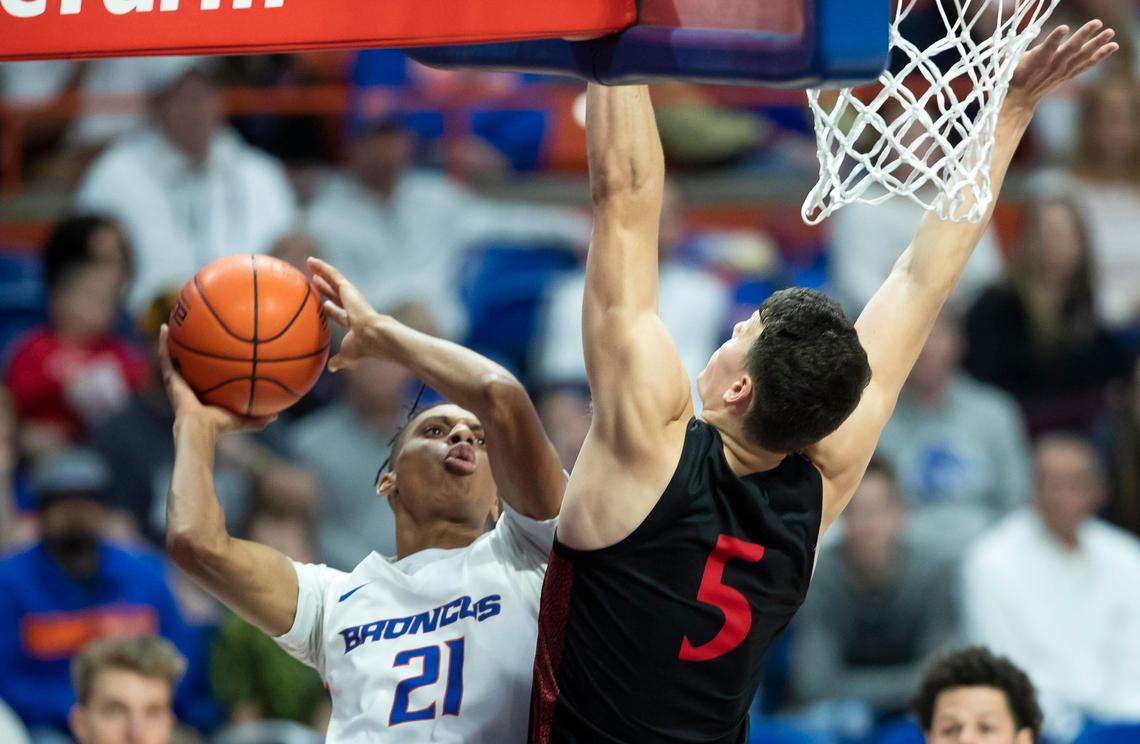 Boise State guard Derrick Alston looks for a shot defended by San Diego State forward Yanni Wetzell in the first half of the Broncos’ Mountain West Conference game Sunday, Feb. 16, 2020 at ExtraMile Arena in Boise.