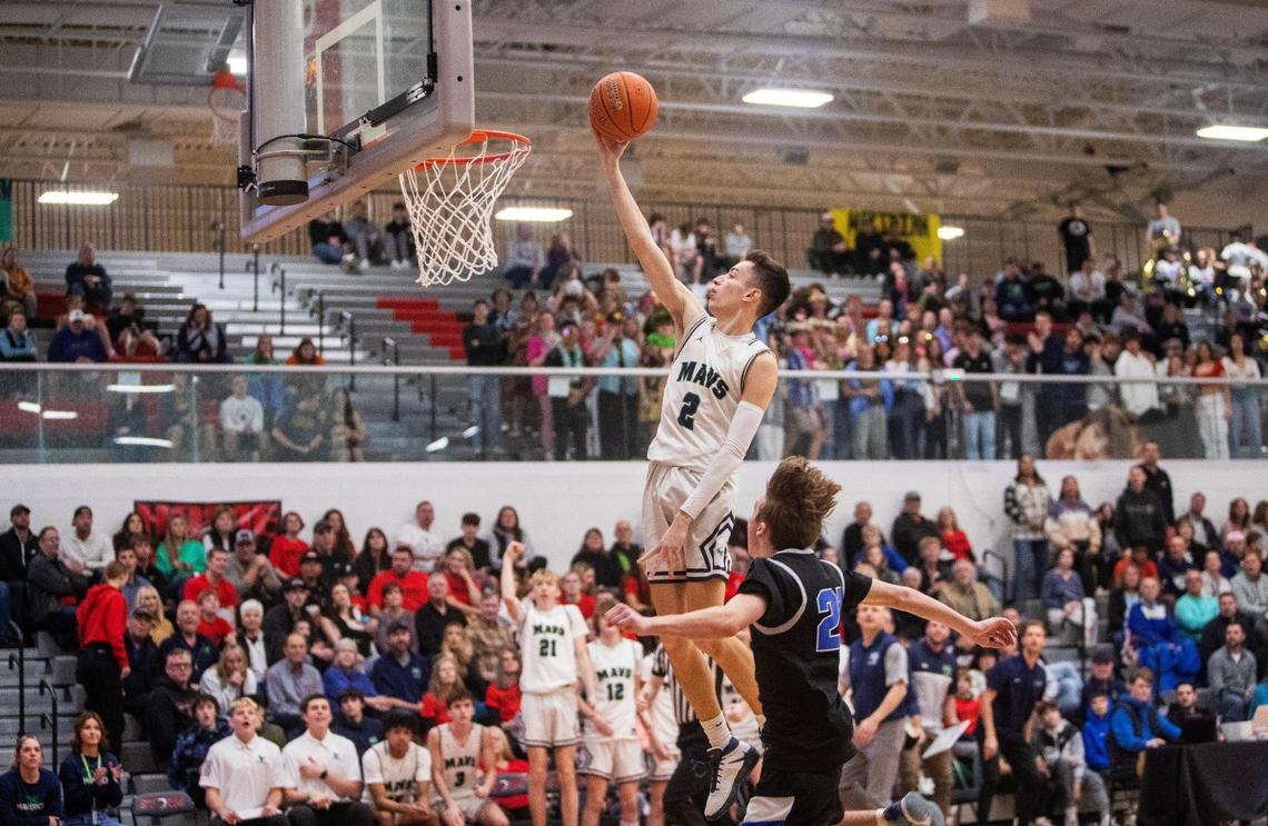 Mountain View junior Brevin Binder turns a steal into two easy points Tuesday against Timberline.
