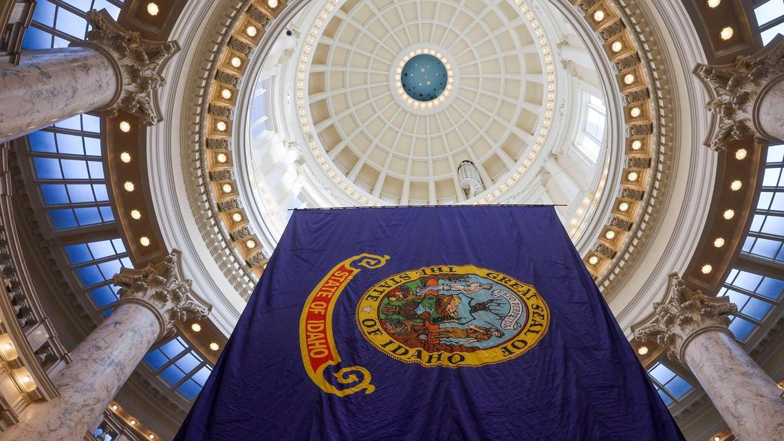 A large Idaho State flag hangs from the Capitol rotunda at the start of the 2022 legislative session Jan. 10 in Boise.