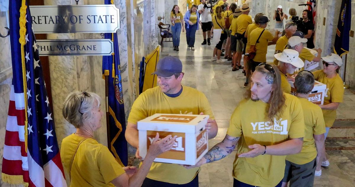 Idahoans for Open Primaries, a coalition backing an initiative to create an open primary and ranked choice voting in Idaho, deliver boxes from every county filled with signatures to deliver to the Idaho Secretary of State’s Office in July.