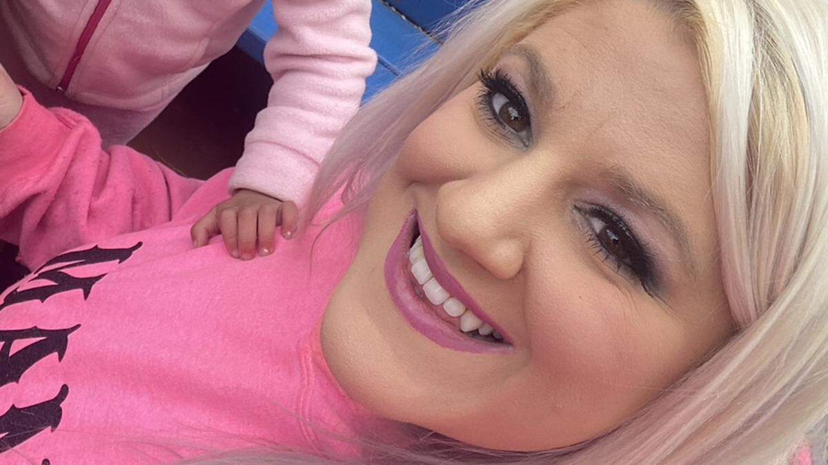 Cassidy Landry is shown with her children.