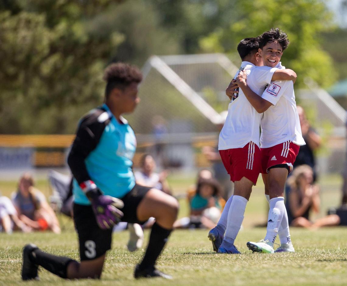 Jeremiah Quinones of the Boise Timbers boys celebrates a goal with teammate Alan Cisneros Hernandez during the U-15 boys Far West Regional quarterfinals on Friday at the Simplot Sports Complex in East Boise.