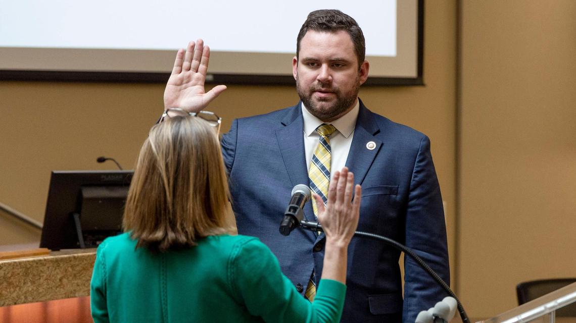 Colin Nash takes the oath of office administered by Mayor McLean.