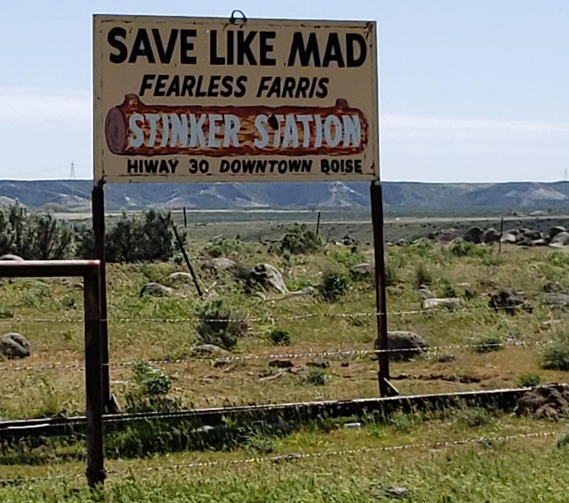 The back side of the humorous signs planted by Farris Lind featured an ad for this Stinker gas stations.