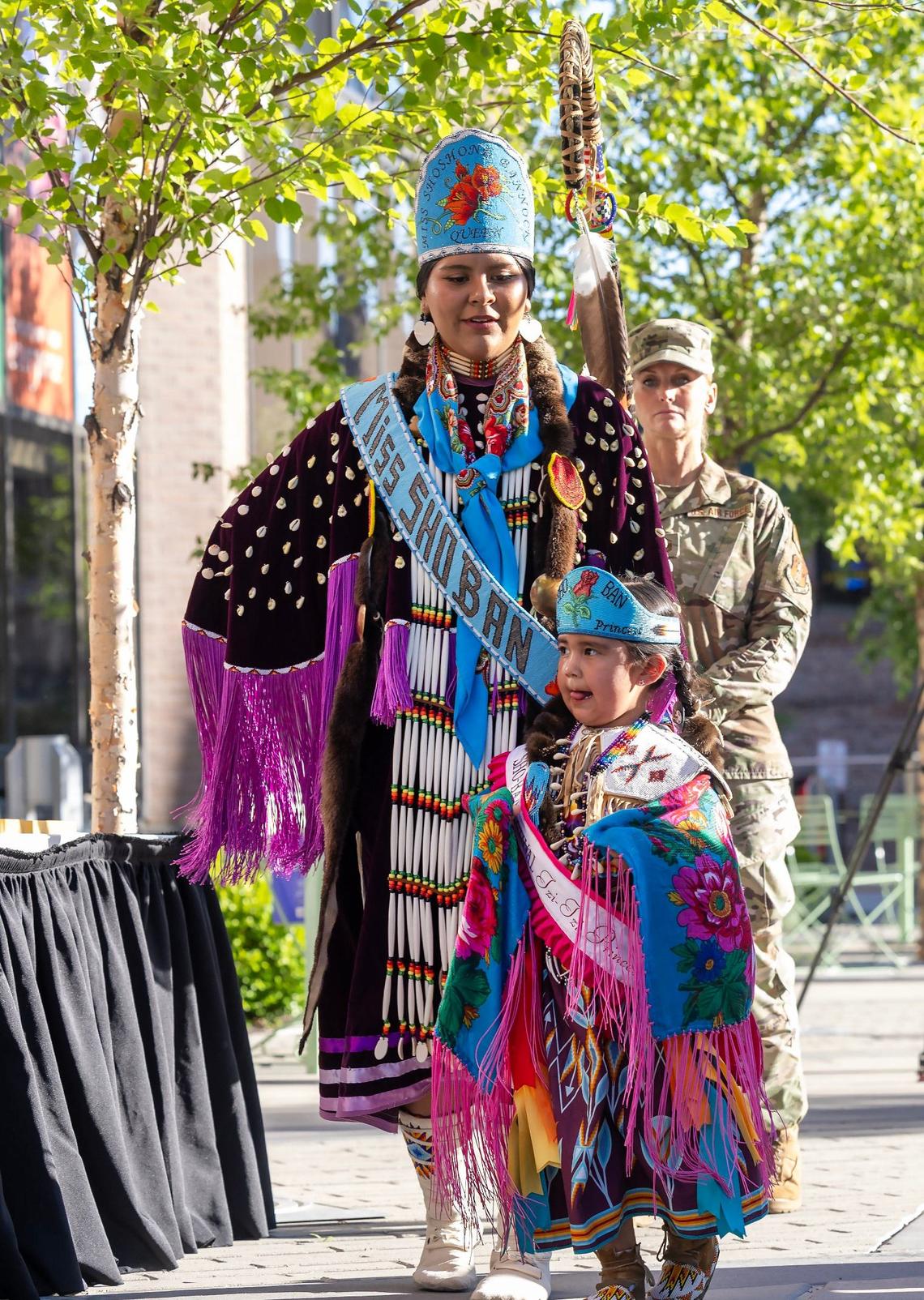 Miss Shoshone-Bannock Develynn Hall and Tzi-tzi Princess Humble Coby, 4, participate in the flag ceremony during the welcome ceremony outside Boise City Hall.