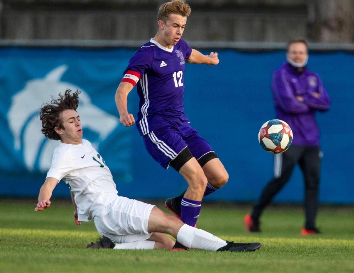 Eagle defender Foster Hull makes a clean tackle on Rocky Mountain’s Keegan Oyler during last year’s 5A District Three championship game.