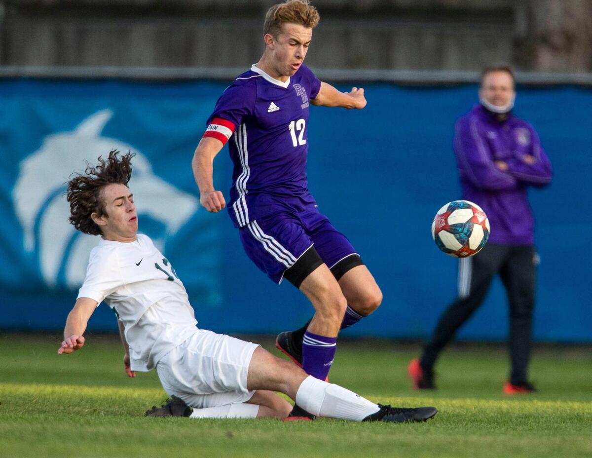Eagle defender Foster Hull makes a clean tackle on Rocky Mountain’s Keegan Oyler during last year’s 5A District Three championship game.