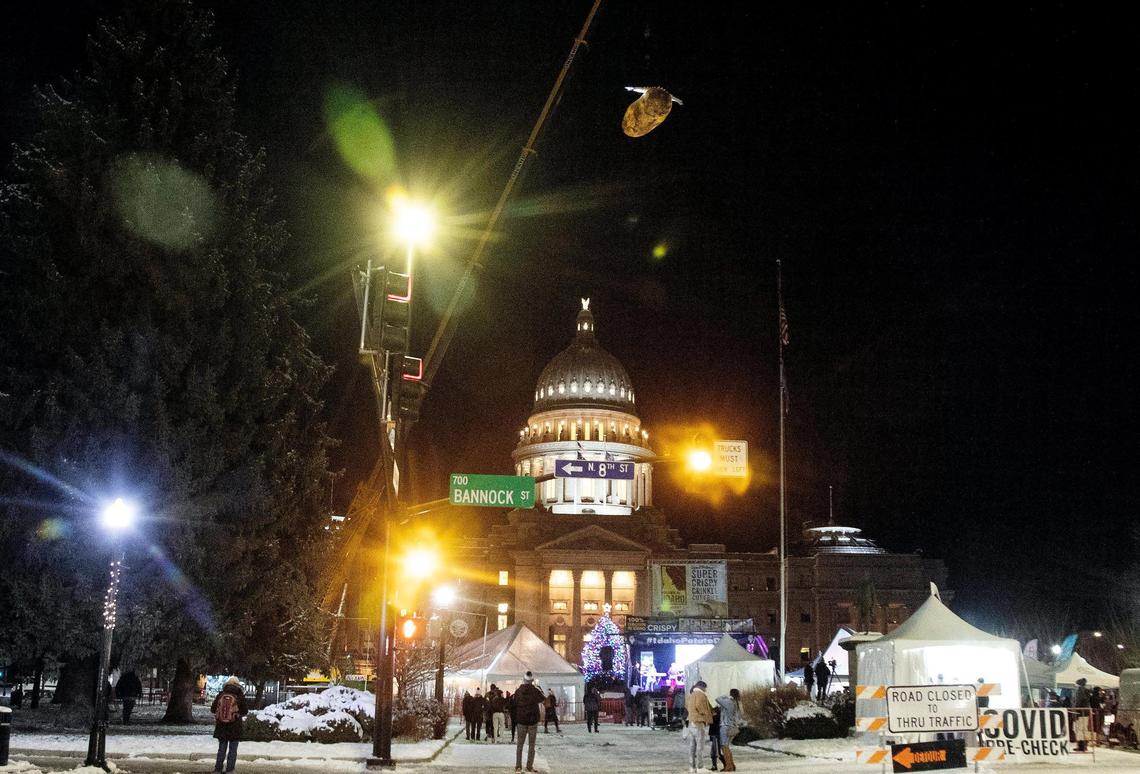 A large potato with wings is lifted into the air by a crane at the start of the Idaho Potato Drop in downtown Boise on Friday, Dec. 31, 2021. After going virtual in 2020, the New Year’s Eve event returned as an in-person celebration in front of the Idaho State Capitol.