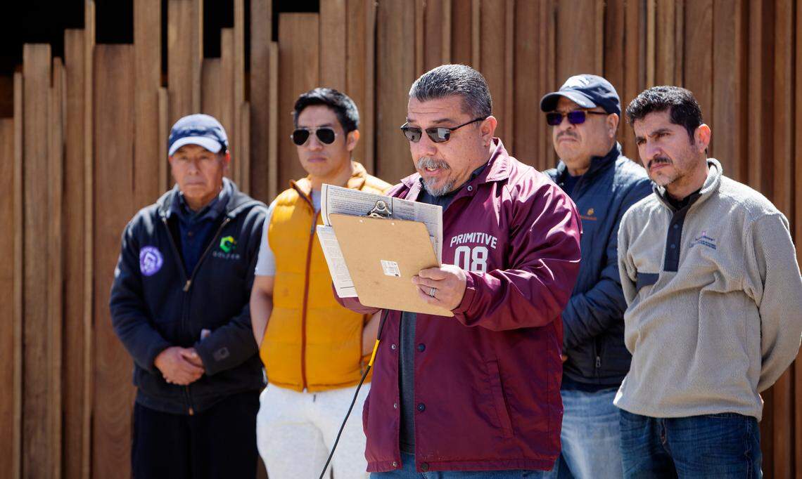 Herbert Romero of the Ketchum Crisis Hotline and Neighbors Helping Neighbors programs stands with a group of residents of J&J Trailer Park on Sunday while speaking at the Occupy Ketchum Town Square rally.