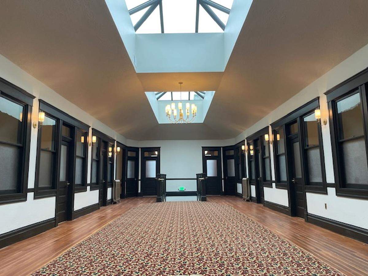 This is what the second floor of the Smith Block building looks like today, after building owner Jade Stacey restored the space preserving as much of the original doors, transom windows, trim, hardwood floors and fixtures.