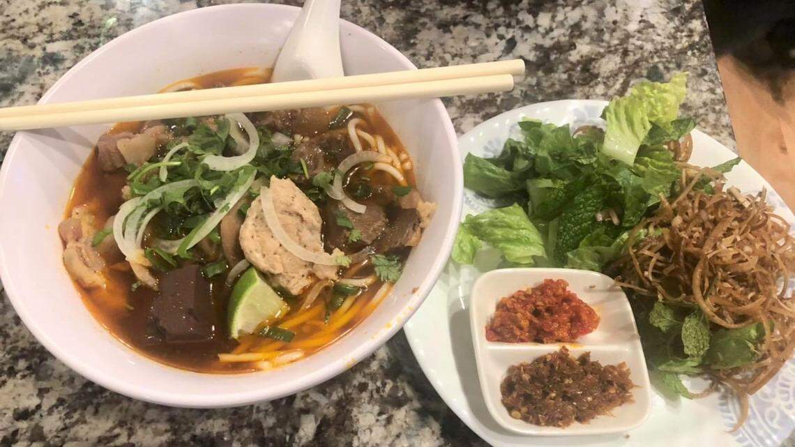 Bun bo Hue (spicy beef noodle soup) is a signature dish.