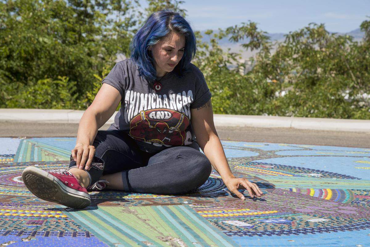 Looking over a section where she included her father’s name in the roundabout mosaic “Infernum Bestiae,” artist Reham Aarti said she is frustrated by the city of Boise’s plan to remove the 306,000-tile mosaic rather than repair it. The mosaic has been subject to repeated vandalism and traffic damage since it was finished in 2014 near the Boise Depot.