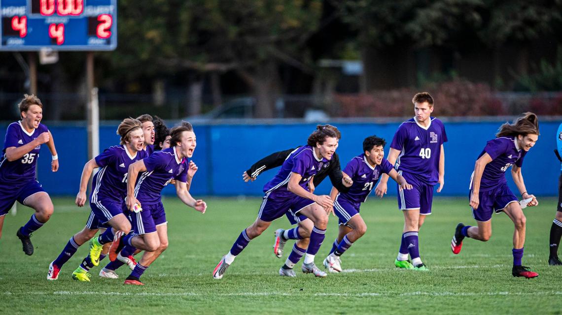 Rocky Mountain rushes goalkeeper Isaac Poole after defeating Eagle 4-2 in a shootout to win the 5A District Three title on Wednesday at Timberline.