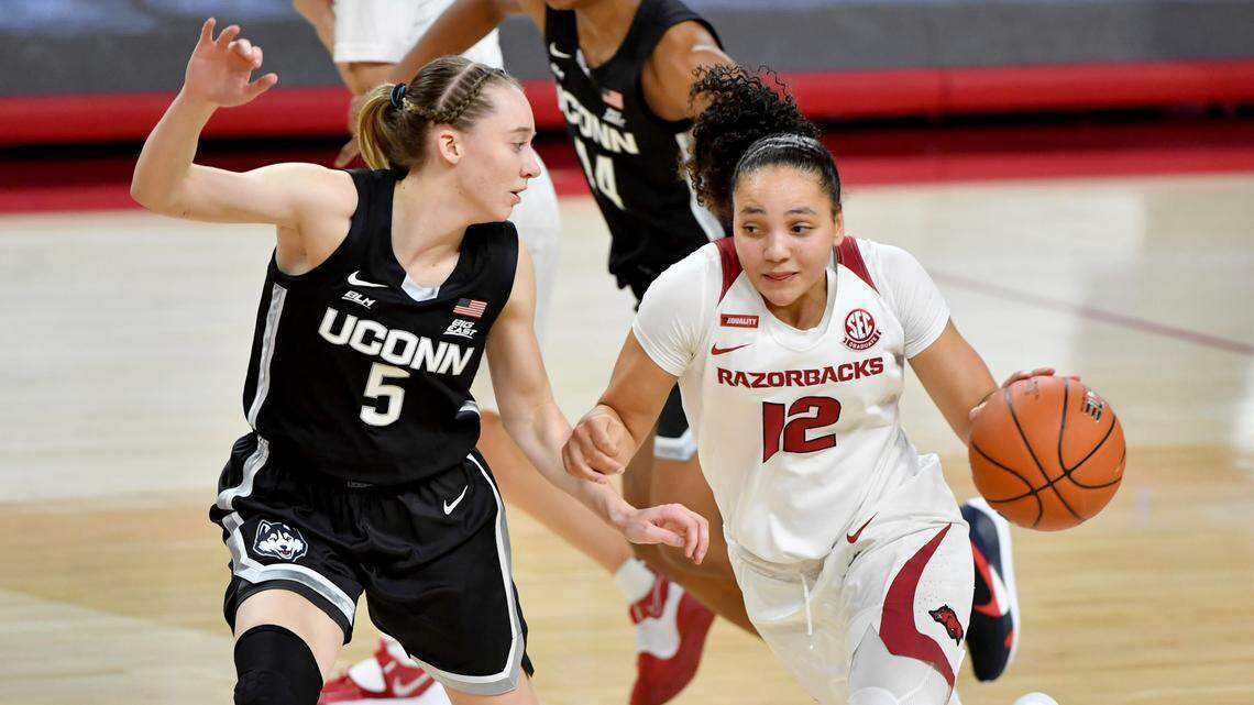Arkansas guard Destiny Slocum, right, tries to drive past Connecticut defender Paige Bueckers during the first half of their game Jan. 28, 2021, in Fayetteville, Ark. Slocum, an Idaho native, heard her name called in the 2021 WNBA Draft on Thursday.