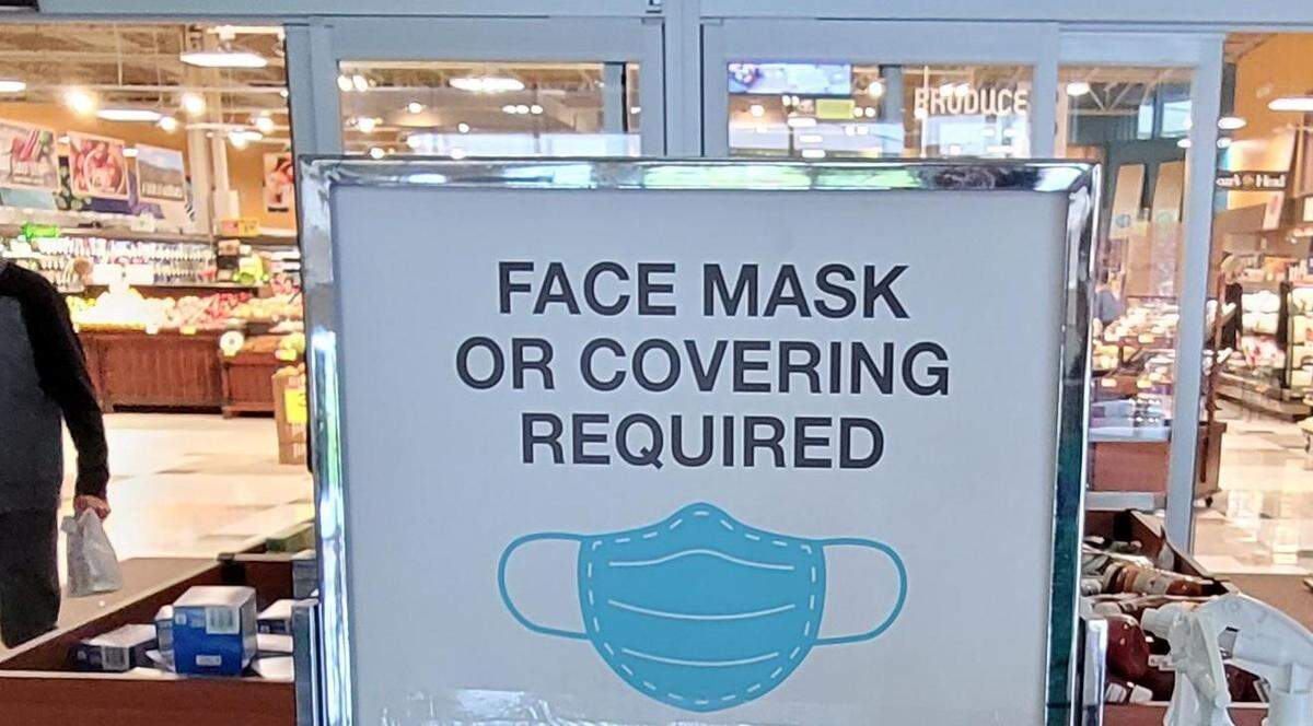 A sign in Boise that required face masks in 2022 during a peak in the COVID-19 pandemic. On Tuesday, Idaho Gov. Brad Little signed a bill into law to block government entities from requiring masks, including in a future pandemic.