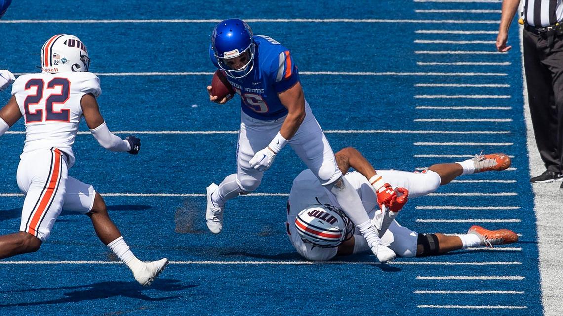 Boise State quarterback Hank Bachmeier scrambles to the sideline for a short gain after being chased by UT-Martin linebacker Tevin Shipp and teammate Andre Brackett on Saturday.