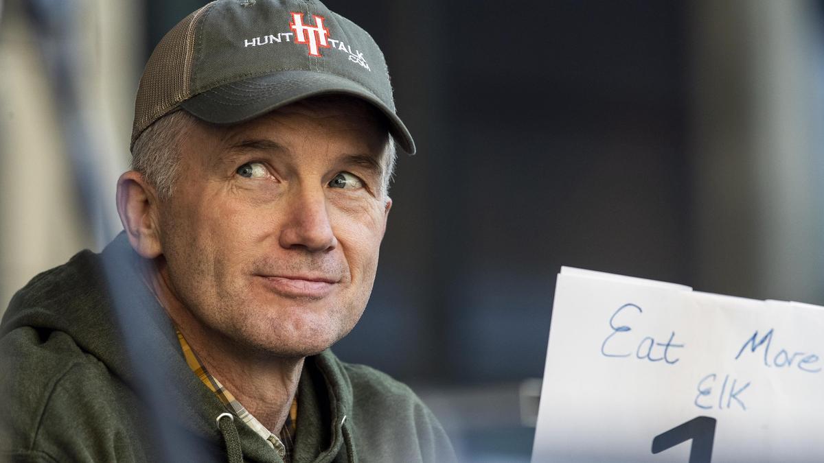 Randy Newberg, Bozeman, Mont., holds ups his judging card as hunters go head-to-head in an elk bugling contest at the Backcountry Hunters and Anglers Rendezvous Friday, May 3, 2019 at the Grove Plaza in Downtown Boise.