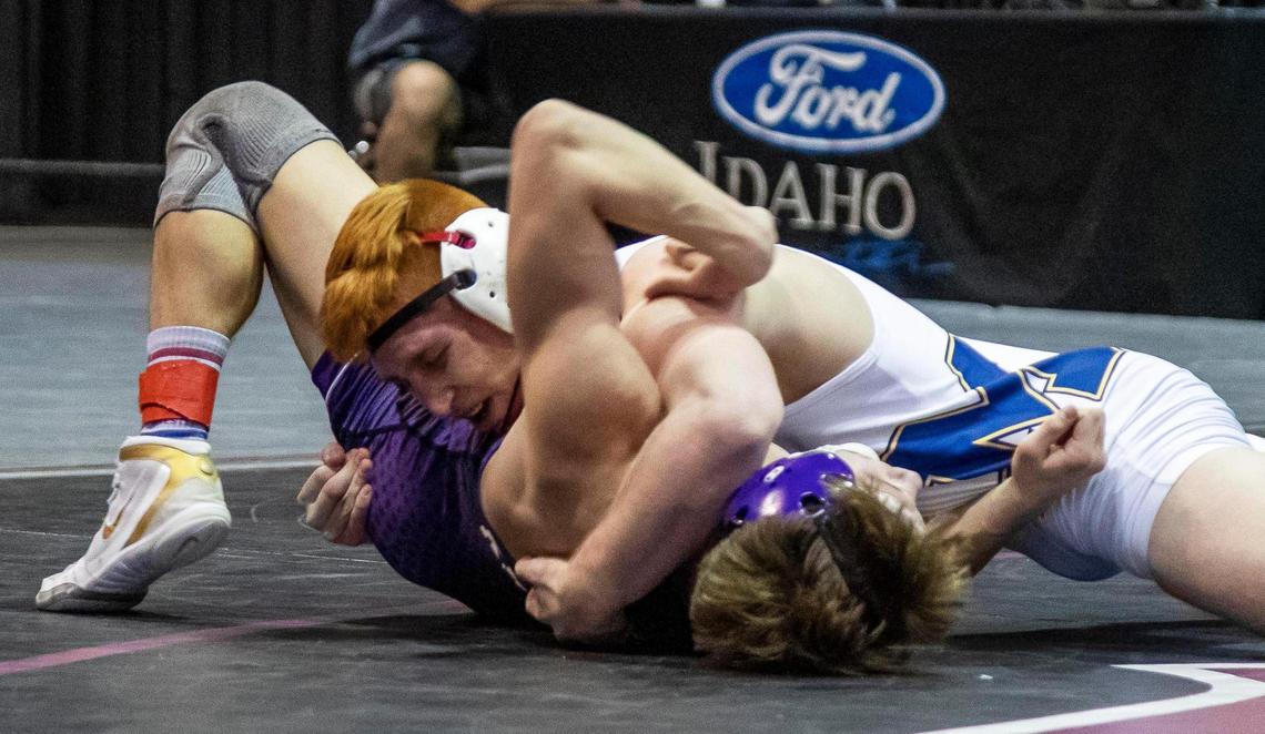 Meridian’s Cade White scores a near fall on Rocky Mountain’s Tyler Jones en route to his second straight state title last year.