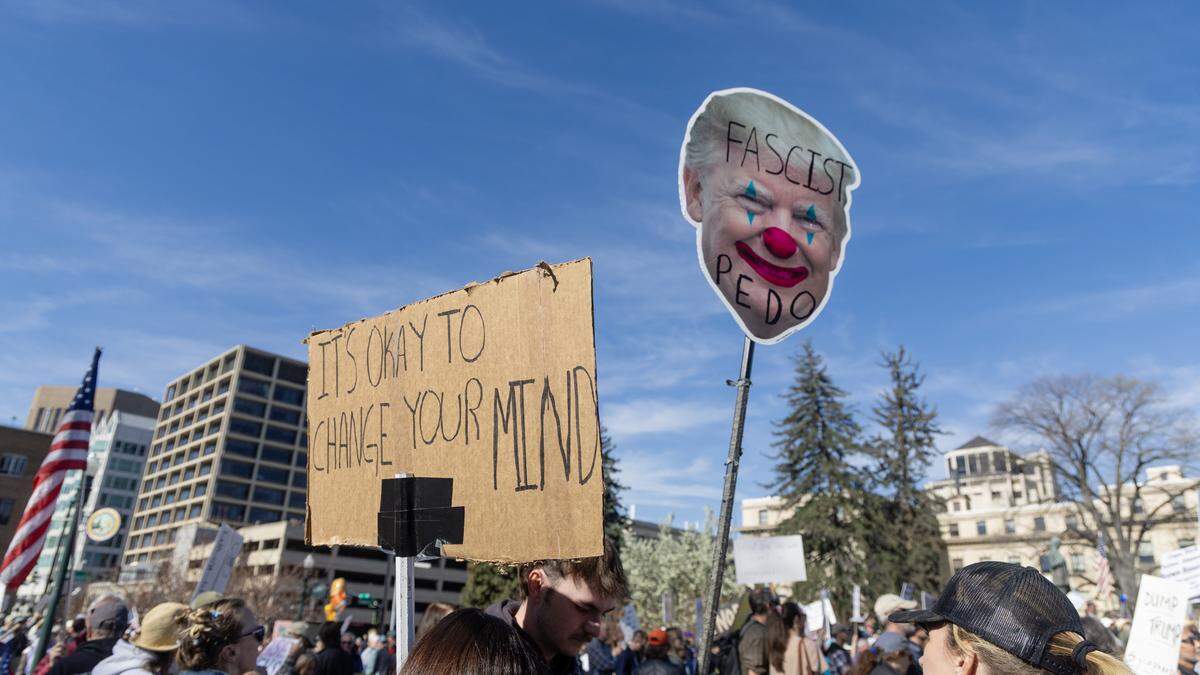 Signs and songs ruled the day during the No Kings protest on Saturday.
