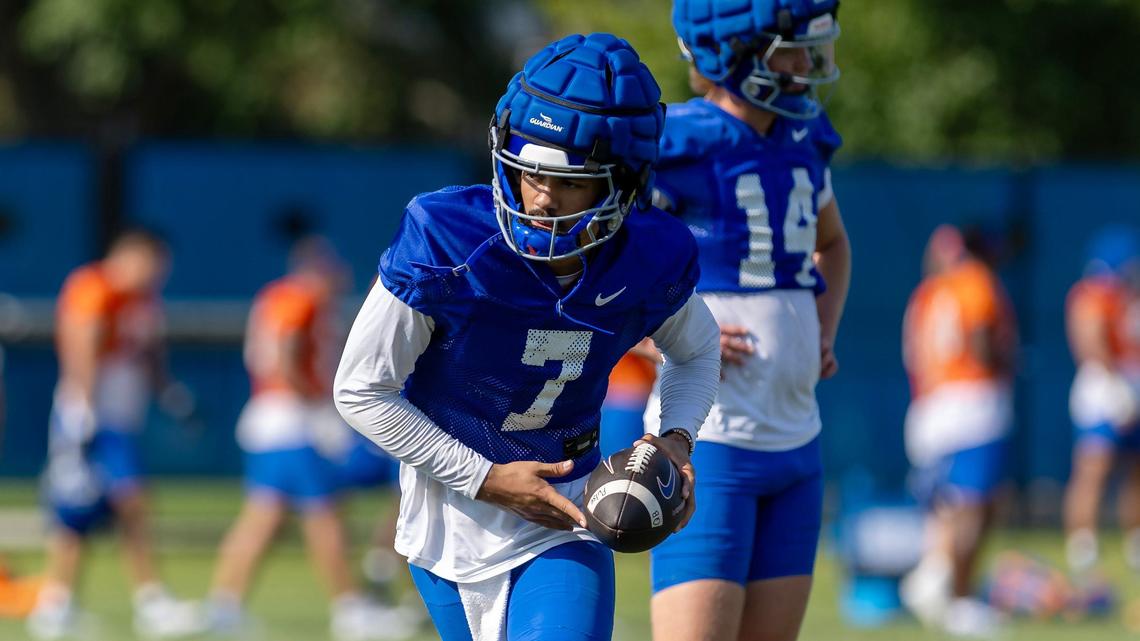 Quarterback Malachi Nelson prepares to hand off the ball during football practice at Boise State University, Thursday, Aug. 1, 2024.