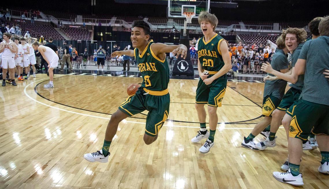 Borah junior Mohammed Naing and the Lions begin their championship celebration after defeating Post Falls 65-56 in the 5A state boy’s basketball championship Saturday, March 7, 2020 at Ford Idaho Center in Nampa.