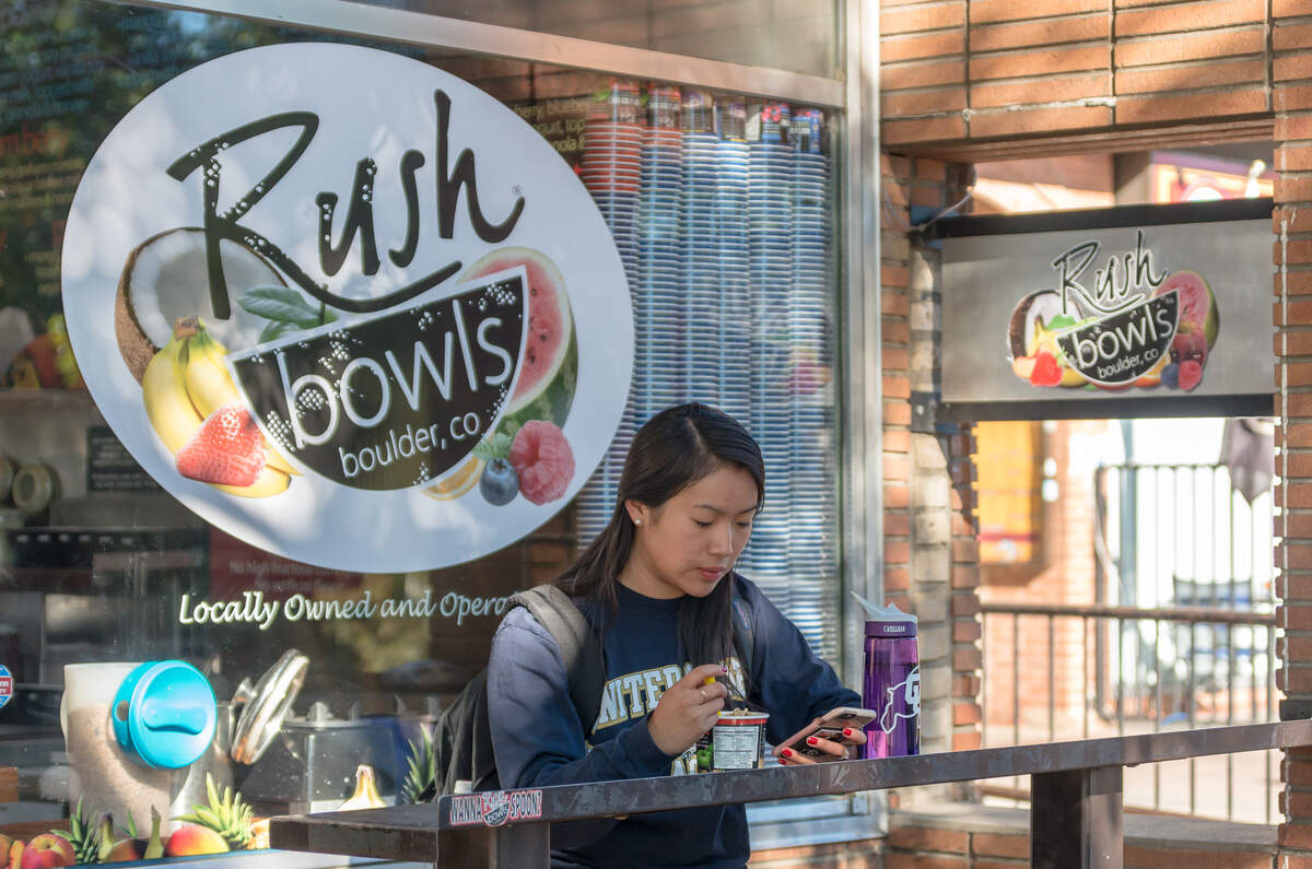A customer eats at a Rush Bowls in Boulder, Colorado.