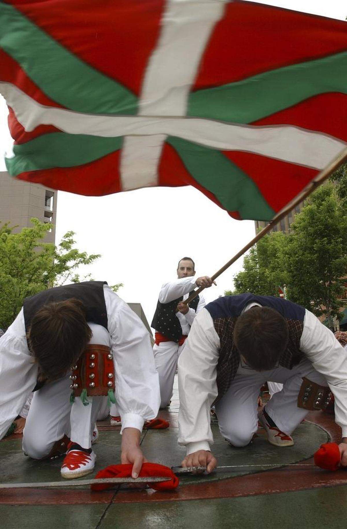 These dancers from Oinkari performed the Ikurrina, or Flag Dance, at Jaialdi in 2005. At the end of this homage to the Basque flag, one dancer swoops it above the kneeling dancers as a “blessing by the authorities.”