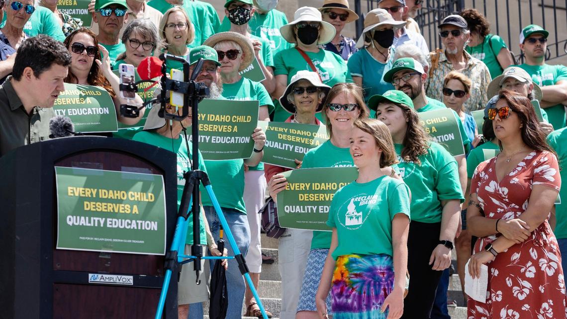 Luke Mayville, co-founder of Reclaim Idaho introduces Anise Welty, 13, to speak at a press conference at the Idaho Capitol in this 2022 file photo. With her mother, Welty helped collect a portion of the over 100,000 signatures for the group’s Quality Education Act initiative.