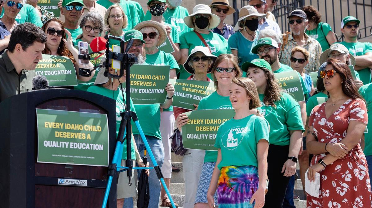 Luke Mayville, co-founder of Reclaim Idaho introduces Anise Welty, 13, to speak at a press conference at the Idaho Capitol on July 6 in this file photo. With her mother, Welty helped collect a portion of the over 100,000 signatures for the group’s Quality Education Act initiative.