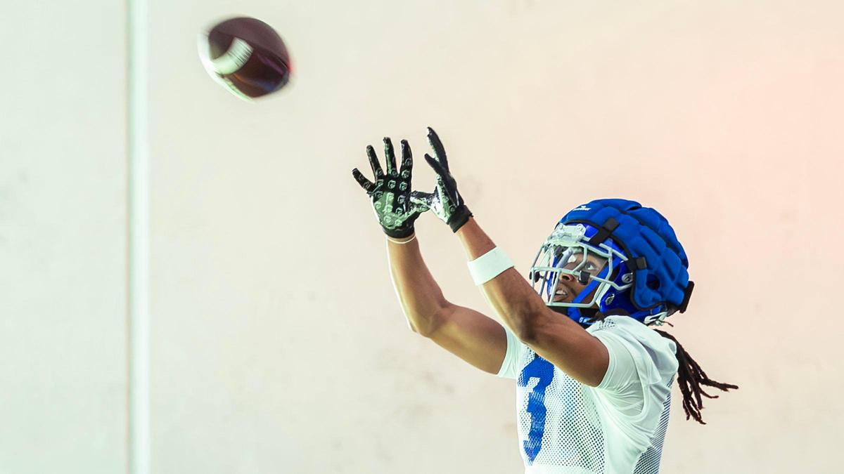 Boise State wide receiver Latrell Caples catches a pass at spring football camp, Monday, March 11, 2024, at the Caven-Williams Indoor Facility in Boise.