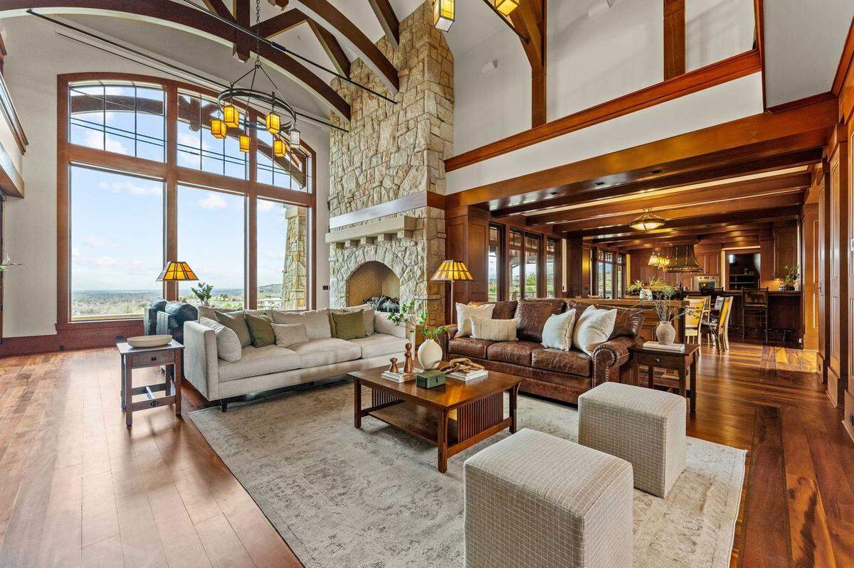 The spacious deck features a large firepit and offers views over the foothills.