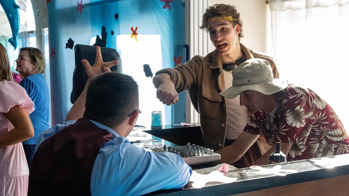 Weston Woodward greets the disc jockeys— Mountain View students Teague Rovig, center, and Kade Andrus, right, during VIP Prom on Saturday at Potomac Manor Event Center in Boise.