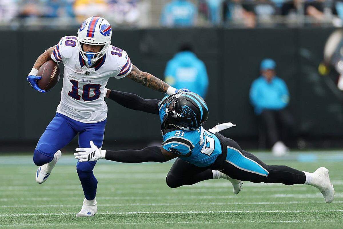 Buffalo’s Khalil Shakir stiff-arms Nick Scott of the Carolina Panthers to score a touchdown on Oct. 26 at Bank of America Stadium in Charlotte, North Carolina.