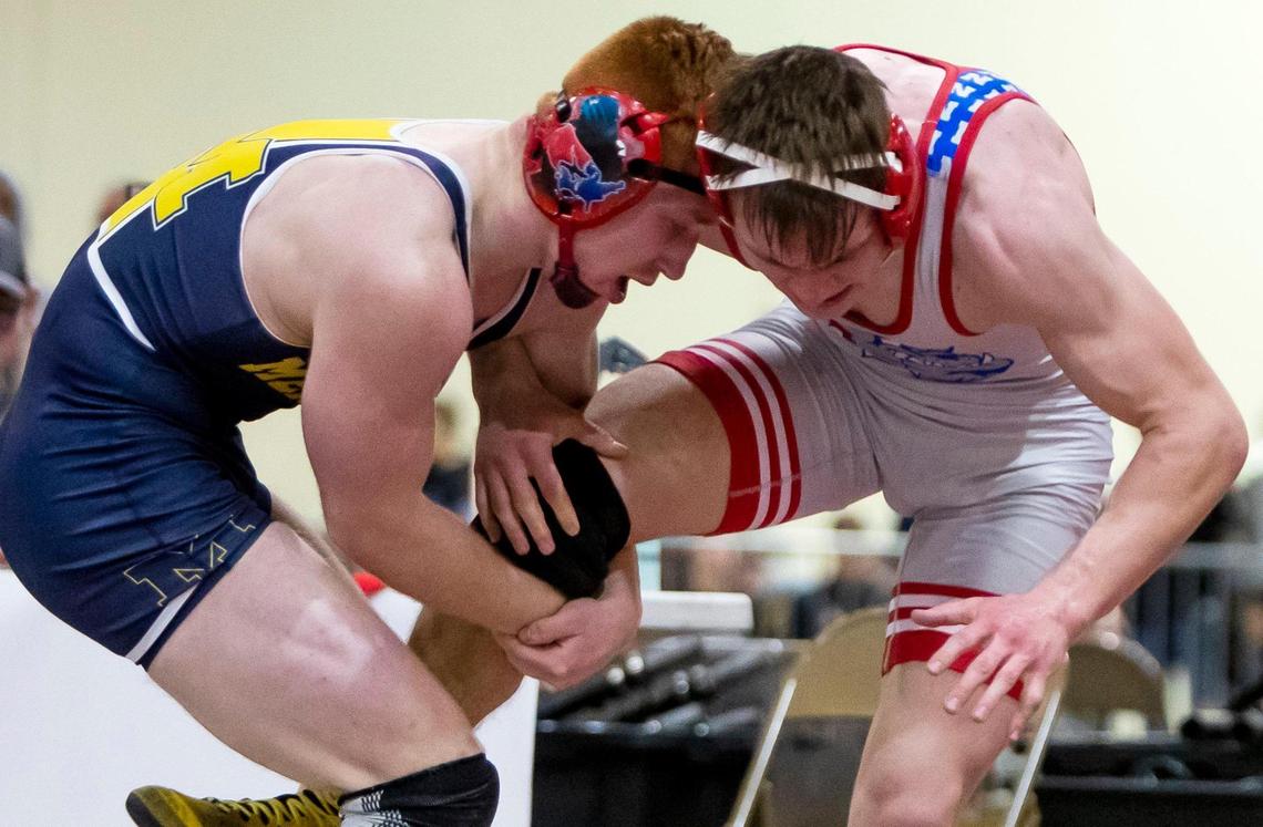 Meridian senior Cade White, left, beat Nampa’s Jonathan Seamons in the 160-pound finals at the 5A District Three wrestling championship Wednesday at Expo Idaho.