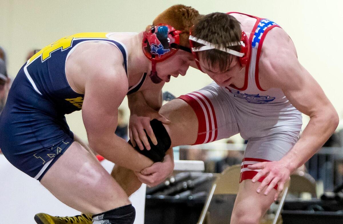 Meridian senior Cade White, left, beat Nampa’s Jonathan Seamons in the 160-pound finals at the 5A District Three wrestling championship Wednesday at Expo Idaho.