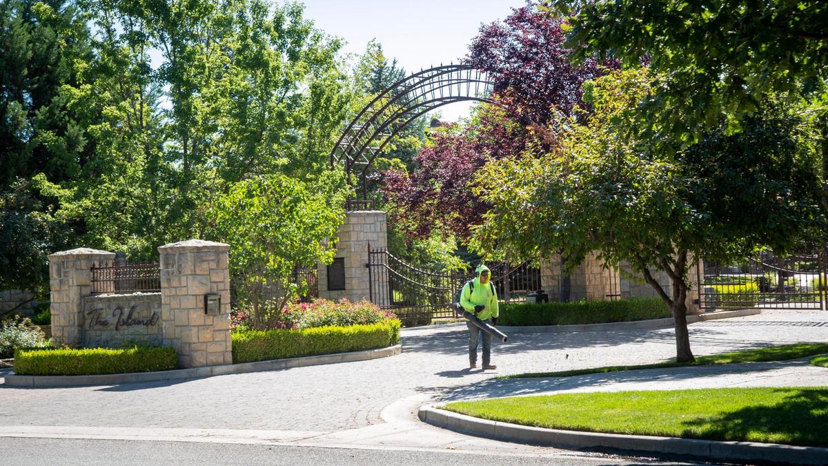 Much of the Two Rivers Homeowners Association budget goes to maintain the hundreds of trees and shrubs that line the streets of the verdant neighborhood. Residents say they move here for the peace and the connection to nature.