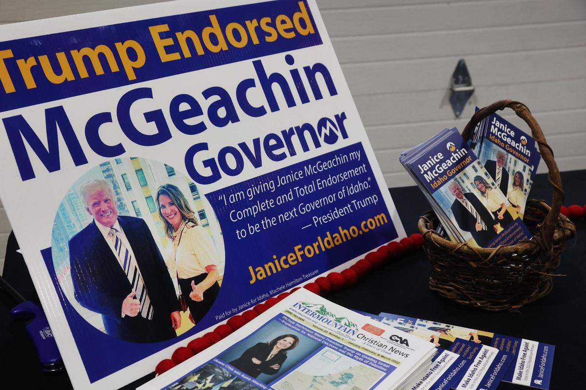 The Janice McGeachin for governor campaign displays signs and pamphlets that prominently show former President Donald Trump’s endorsement.