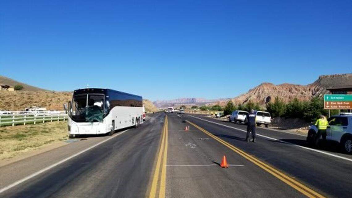 Two died after a family in an SUV collided with a tour bus in Utah, police said.
