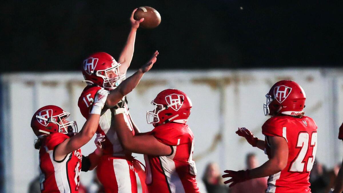 Homedale quarterback Jaxon Dines celebrates the Trojans’ first touchdown against 3A SRV foe Weiser on Friday at Homedale High School. Homedale won the game 14-6.