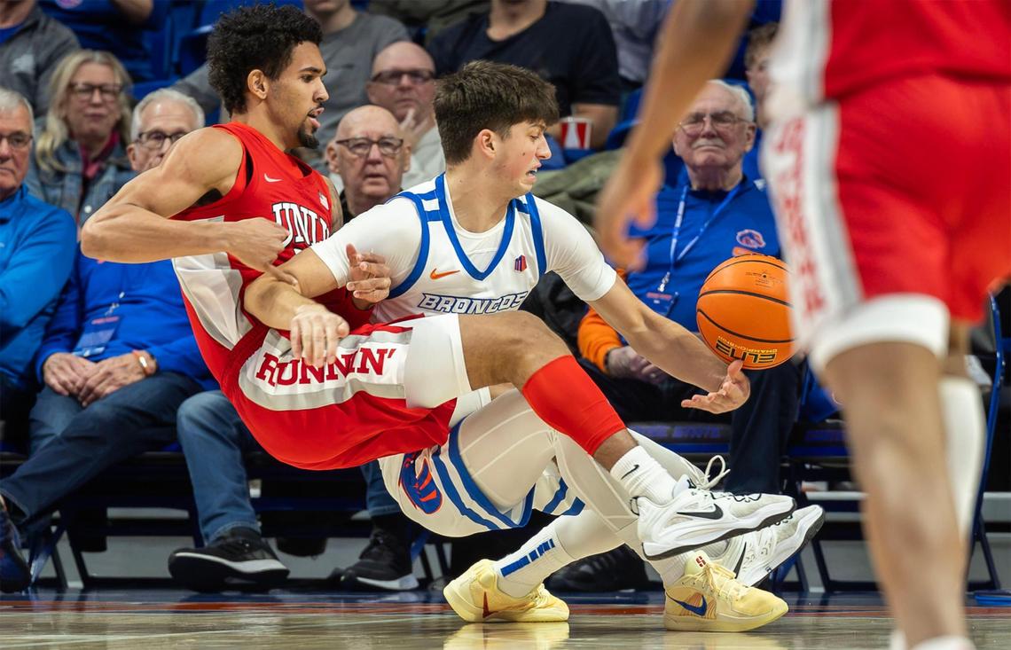 Boise State forward Pearson Carmichael wins a battle for the ball with UNLV guard Jailen Bedford in the first half Tuesday at ExtraMile Arena.