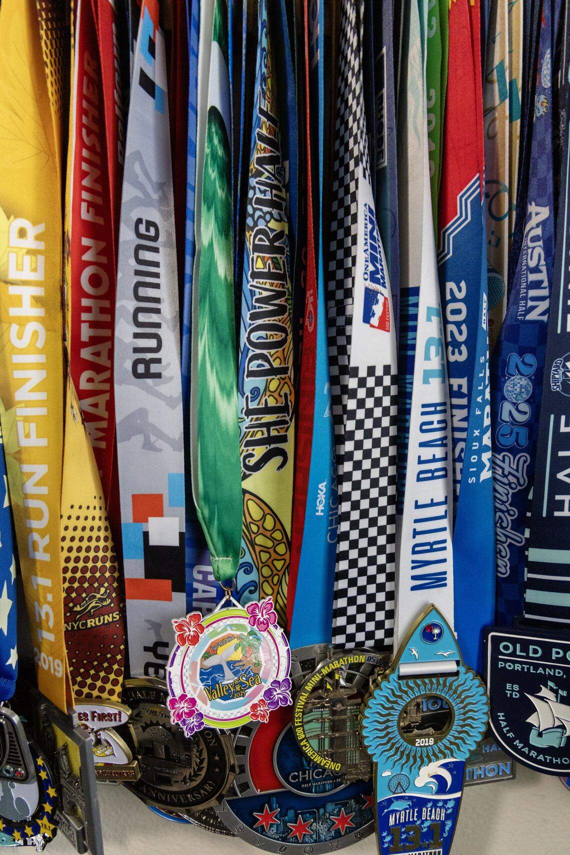 Meridian resident Tera Gibb has a display of medals from completing a half marathon in all 50 states.