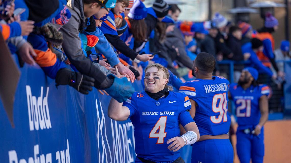 Boise State quarterback Maddux Madsen greets fans after the Broncos’ 34-18 win over Oregon State.