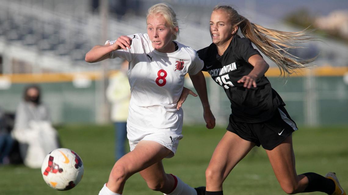 Logan Smith runs past Rocky Mountain’s McKenna Doremus to score the game-winning goal in Boise’s 2-1 victory in the 5A District Three championship game Wednesday at Mountain View High School.