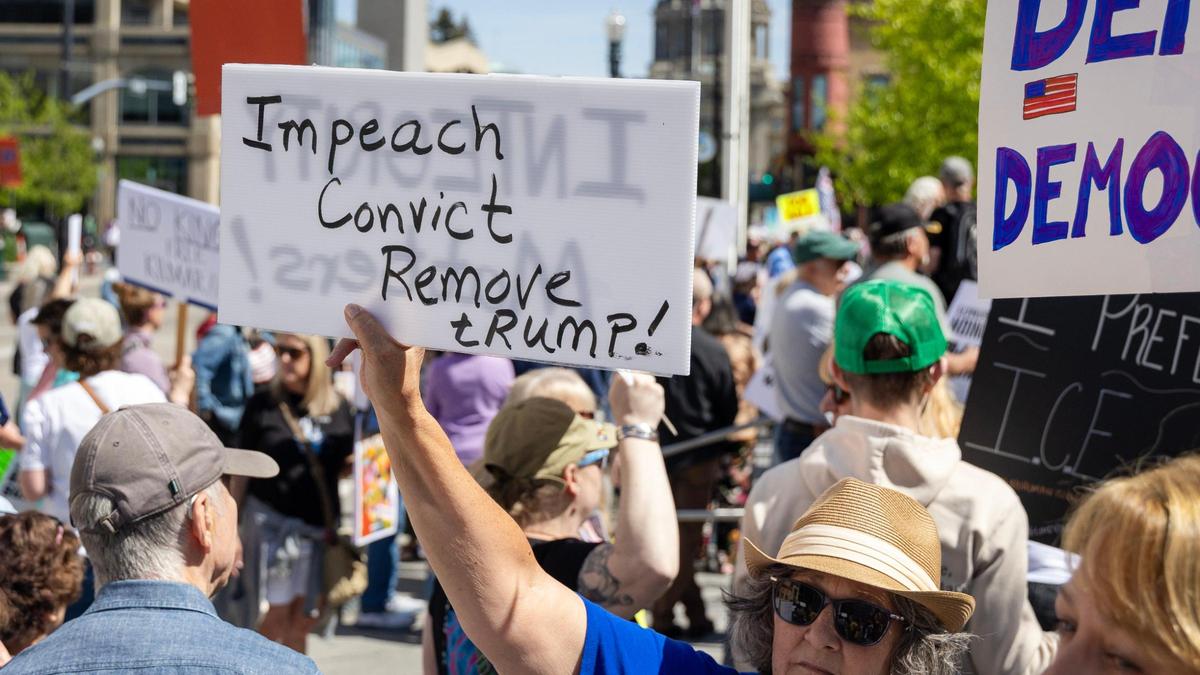 People gather for a May Day protest of Trump and his immigration and labor policies and Elon Musk’s DOGE cuts held at Boise City Hall, Thursday, May 1, 2025.