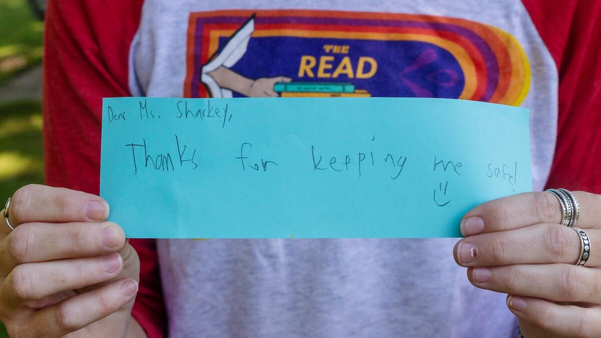 Julia Sharkey, a former teacher, holds a note from a student that thanked her being an ally for LGBTQ+ people. Sharkey resigned after a new law in Idaho put restrictions on teachers’ use of pronouns. The law took effect July 1.