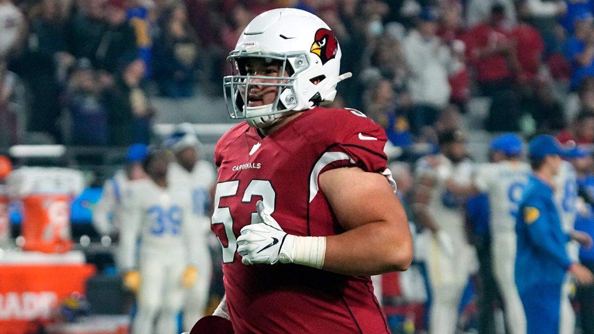 Arizona Cardinals backup center Marcus Henry runs off the field during a game against the Los Angeles Rams on Dec. 13 in Glendale, Arizona.