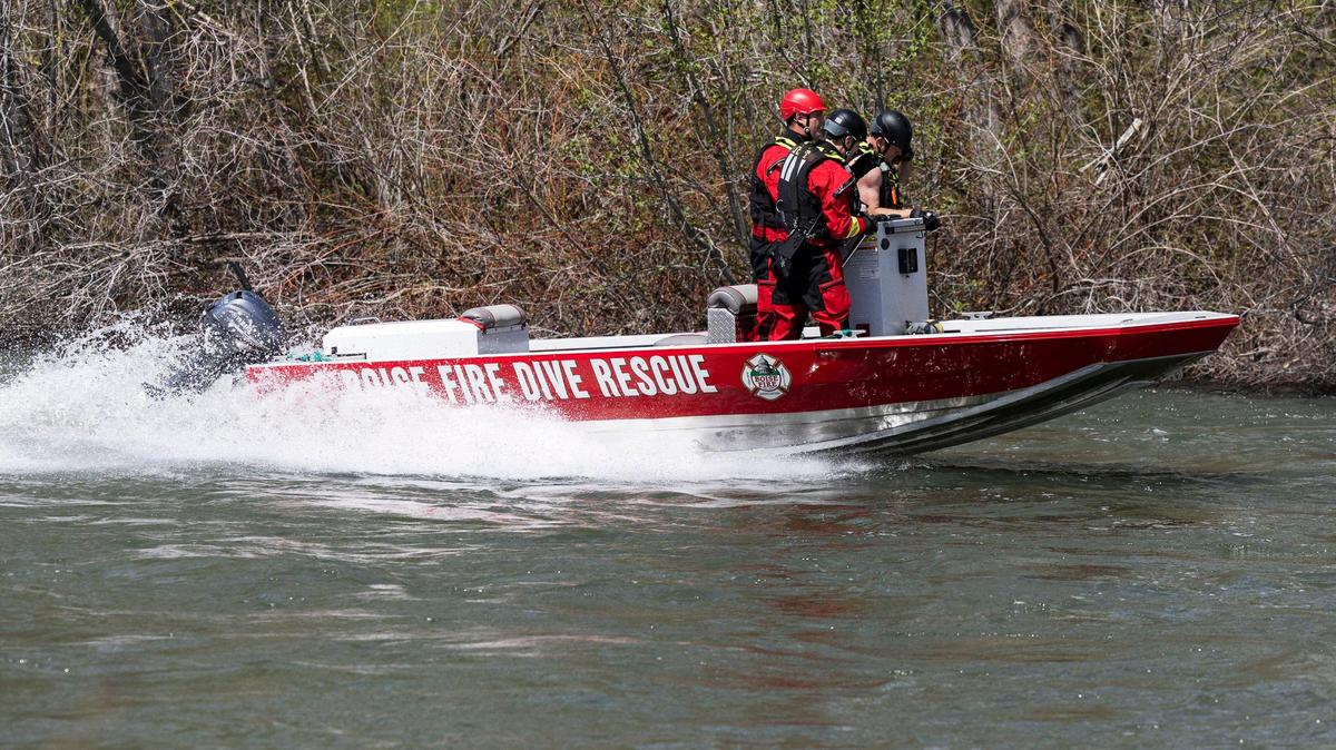 Emergency teams search for a kayaker reported missing on the Boise River below Barber Park on Monday.