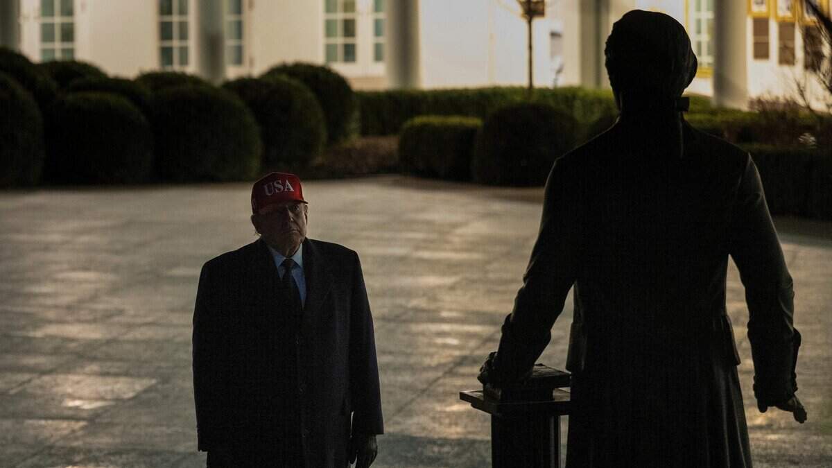 US President Donald Trump looks at a statue of Thomas Jefferson in the Rose Garden upon returning to the White House in Washington, DC, on March 1, 2026. The United States and Israel launched massive bombardments against Iran and killed its supreme leader on February 28, with attacks ongoing Sunday. The US military on Sunday said three service members have been killed and five seriously wounded in the war against Iran -- the first casualties announced on the US side. (Photo by Brendan Smialowski / AFP via Getty Images)