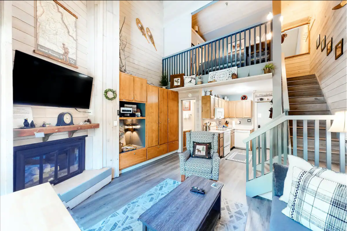 This third-floor retreat boasts a homey living space with a gas fireplace, a smart TV equipped with a Blu-ray and DVD player, and a well-equipped kitchen.